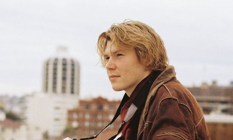 A picture of Elizabeth Cullen's brother Julian Cullen with a camera.